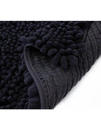 Tapete baño Shaggy Coral gris oscuro 40x60 cm con textura suave y diseño contemporáneo ideal para baño en espacios modernos