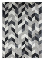 Tapete Shift chevron gris con textura suave y diseño contemporáneo ideal para sala o recámara en espacios modernos