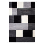 Tapete Shaggy Supreme cuadros gris 200x290 cm con textura suave y diseño moderno que brinda confort y amplitud visual