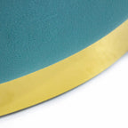 Taburete Portofino terciopelo turquesa con acabado suave y color vibrante que añade un toque sofisticado y moderno