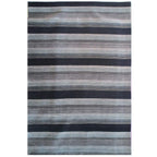 Tapete Bazhars Primavera gris con textura suave y diseño contemporáneo ideal para sala o recámara en espacios modernos