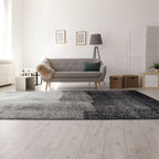 Tapete Softness gris con textura suave y diseño contemporáneo ideal para sala o recámara en espacios modernos