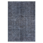 Tapete Antique turco gris con textura suave y diseño contemporáneo ideal para sala o recámara en espacios modernos