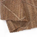 Tapete Yute Cassava Cross con textura natural y diseño contemporáneo ideal para sala o recámara en espacios modernos