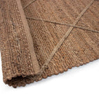 Tapete Yute Cassava Cross con textura natural y diseño contemporáneo ideal para sala o recámara en espacios modernos