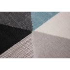 Tapete Shift triángulos azul 200x290 cm con textura resistente y diseño contemporáneo ideal para interior o exterior en espacios modernos
