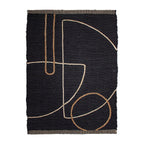 Tapete Yute Trace black con textura natural y diseño contemporáneo ideal para sala o recámara en espacios modernos
