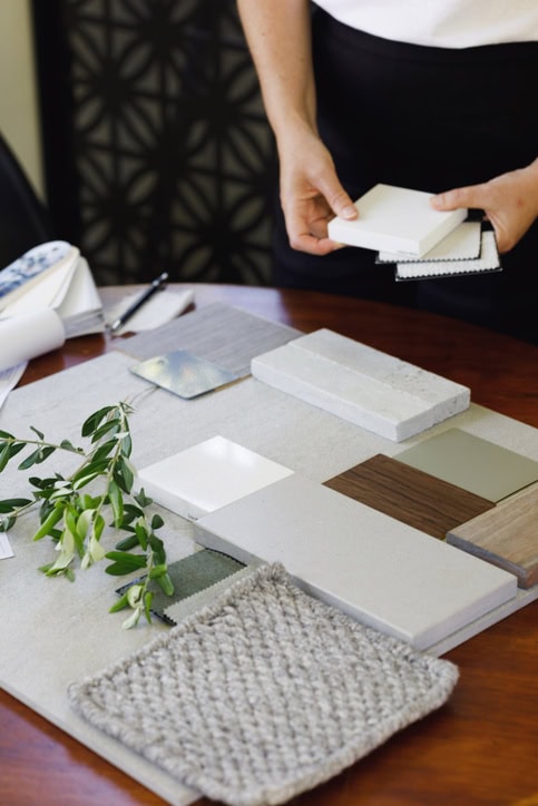 Designer laying out a sample board